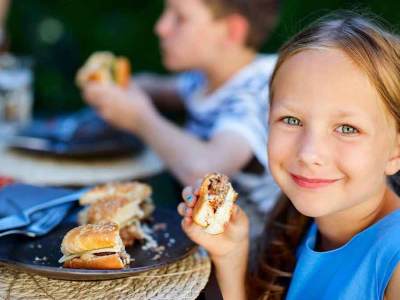 child eating burger